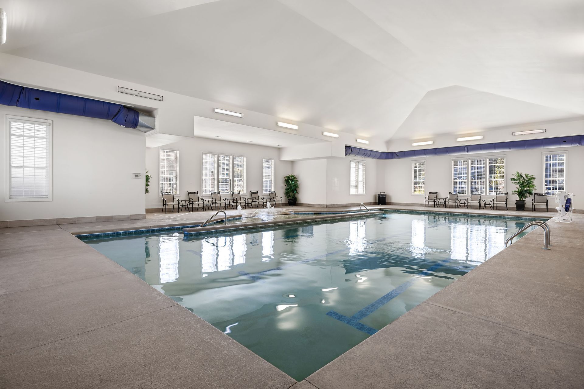 There is a large indoor swimming pool in the middle of the room at Marquis Ellis Crossing offers apartments with indoor pool in Durham, NC.