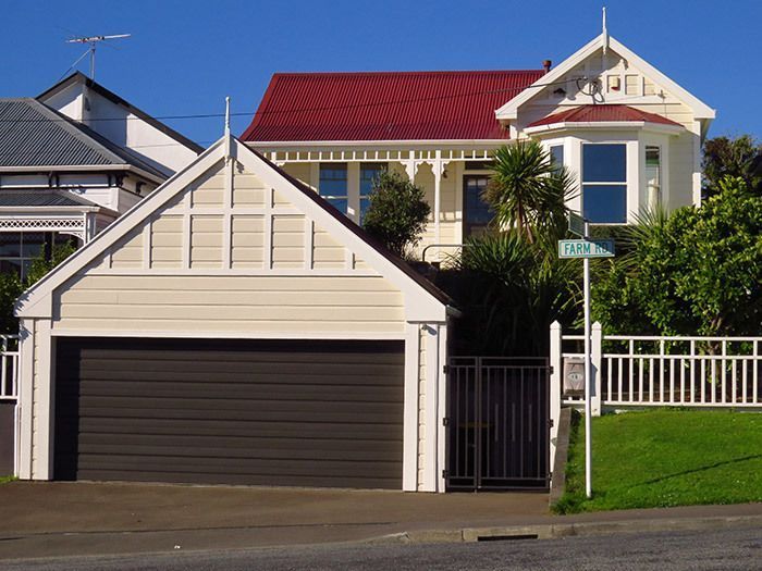 A large white house with a red roof and a garage — Wellington, NZ — Gavin Chan Decorators Ltd