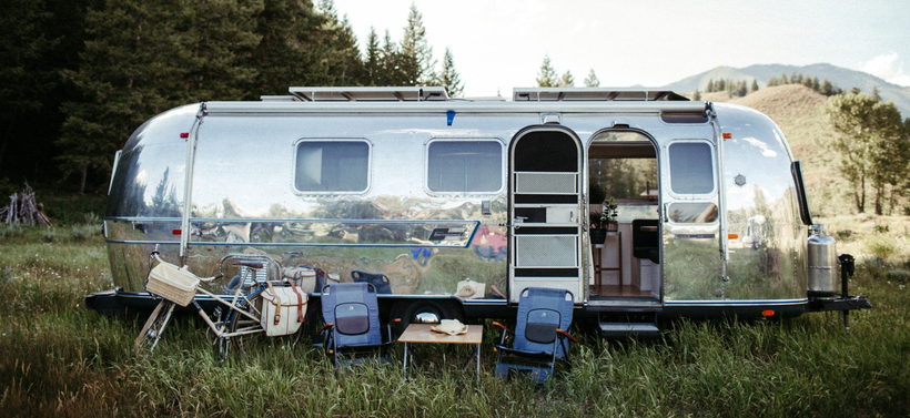 Vintage polished Airstream exterior in the mountains