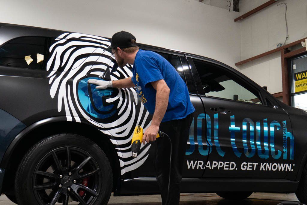 Vinyl wrap overlays on Dodge Durango for custom branding