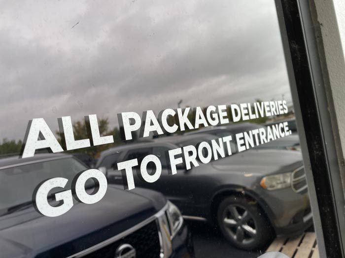 white vinyl window graphic on a rear door