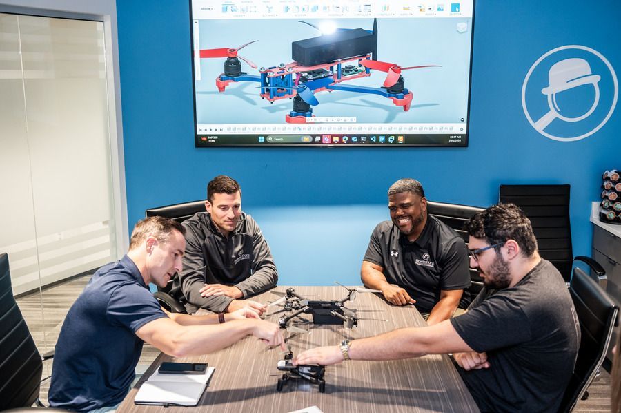 Owner Mark Holmes and staff in Bowler Pons conference room
