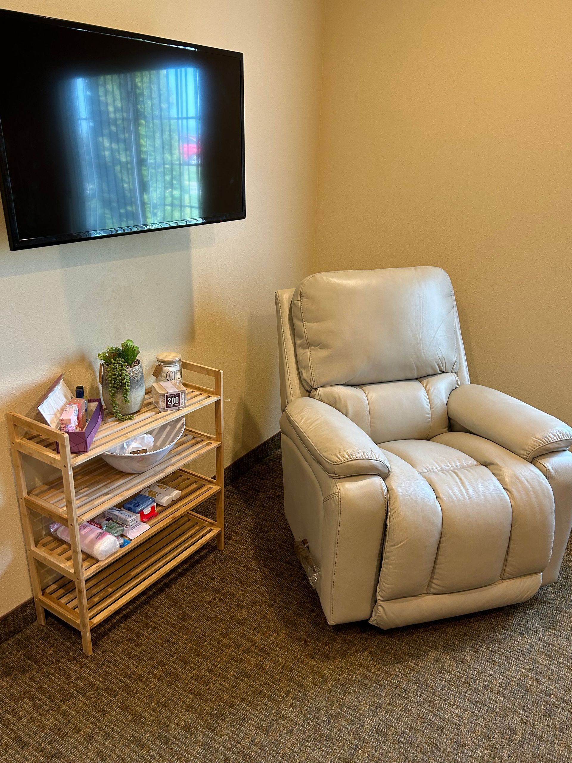 There is a chair and a television in the room.