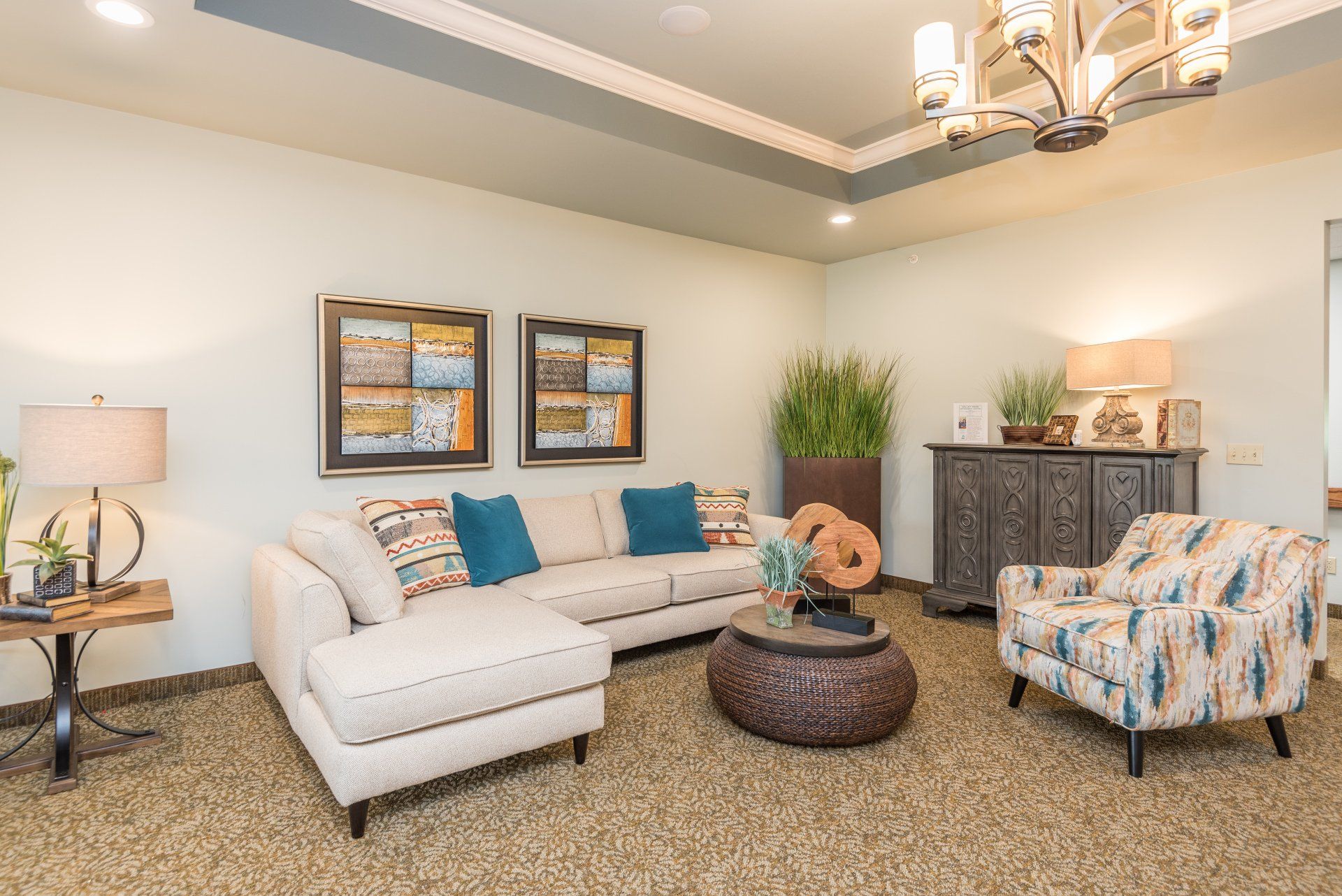 A living room filled with furniture and a chandelier.
