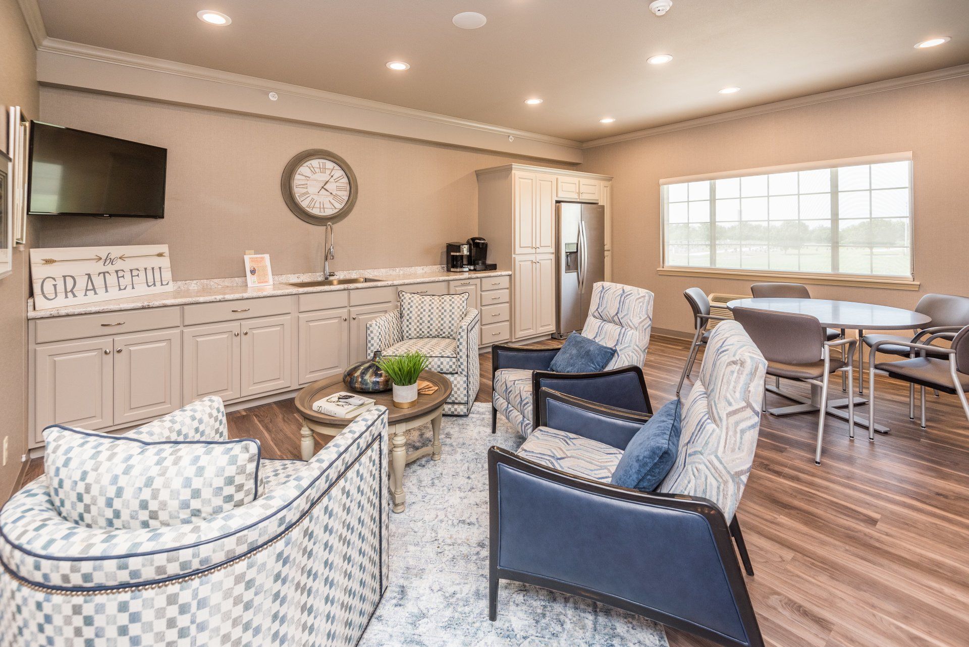 A living room filled with furniture and a television.