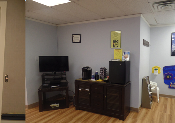 A corner of a room with a tv on a stand