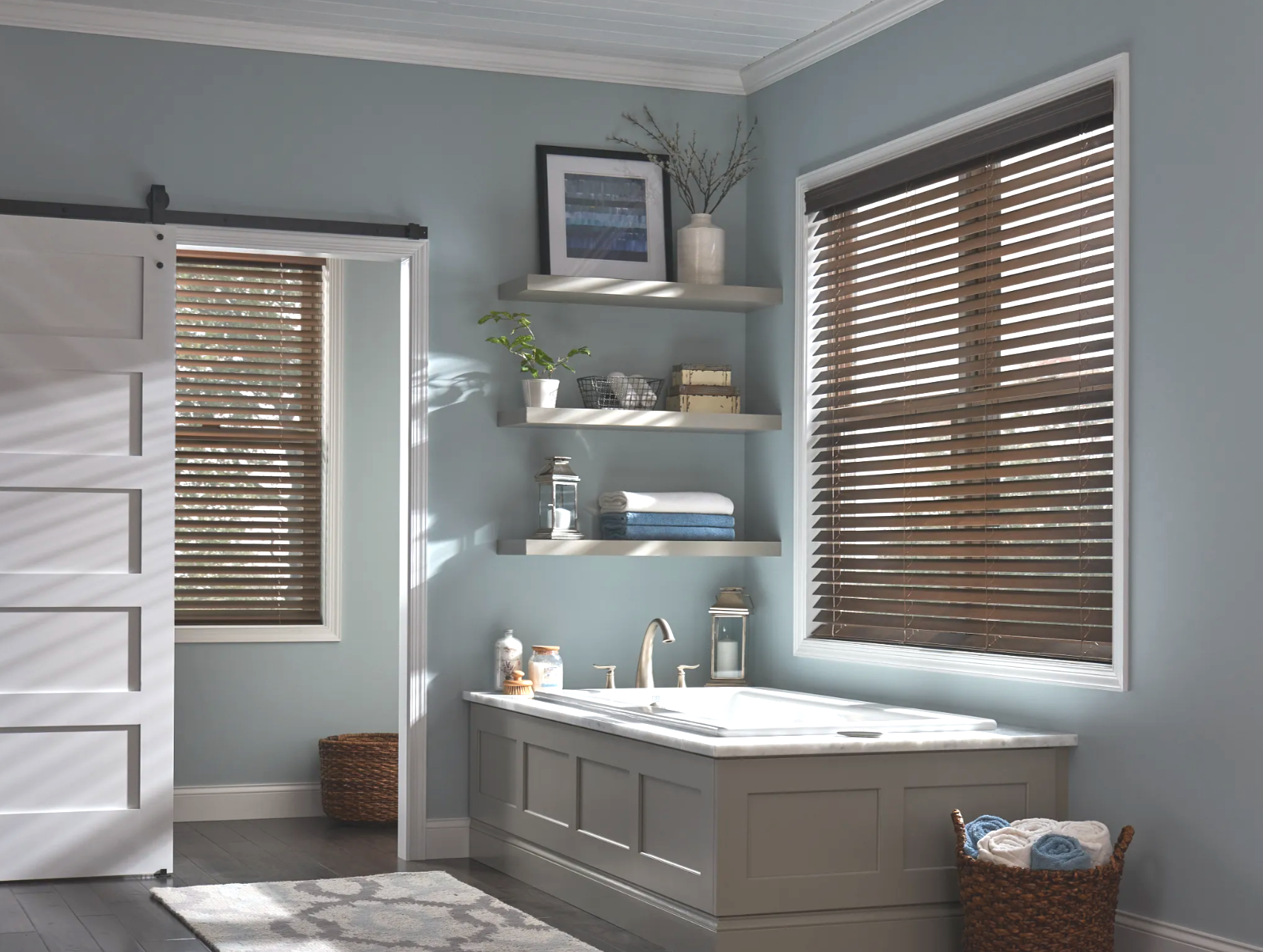 A bathroom with a bathtub and a sliding barn door