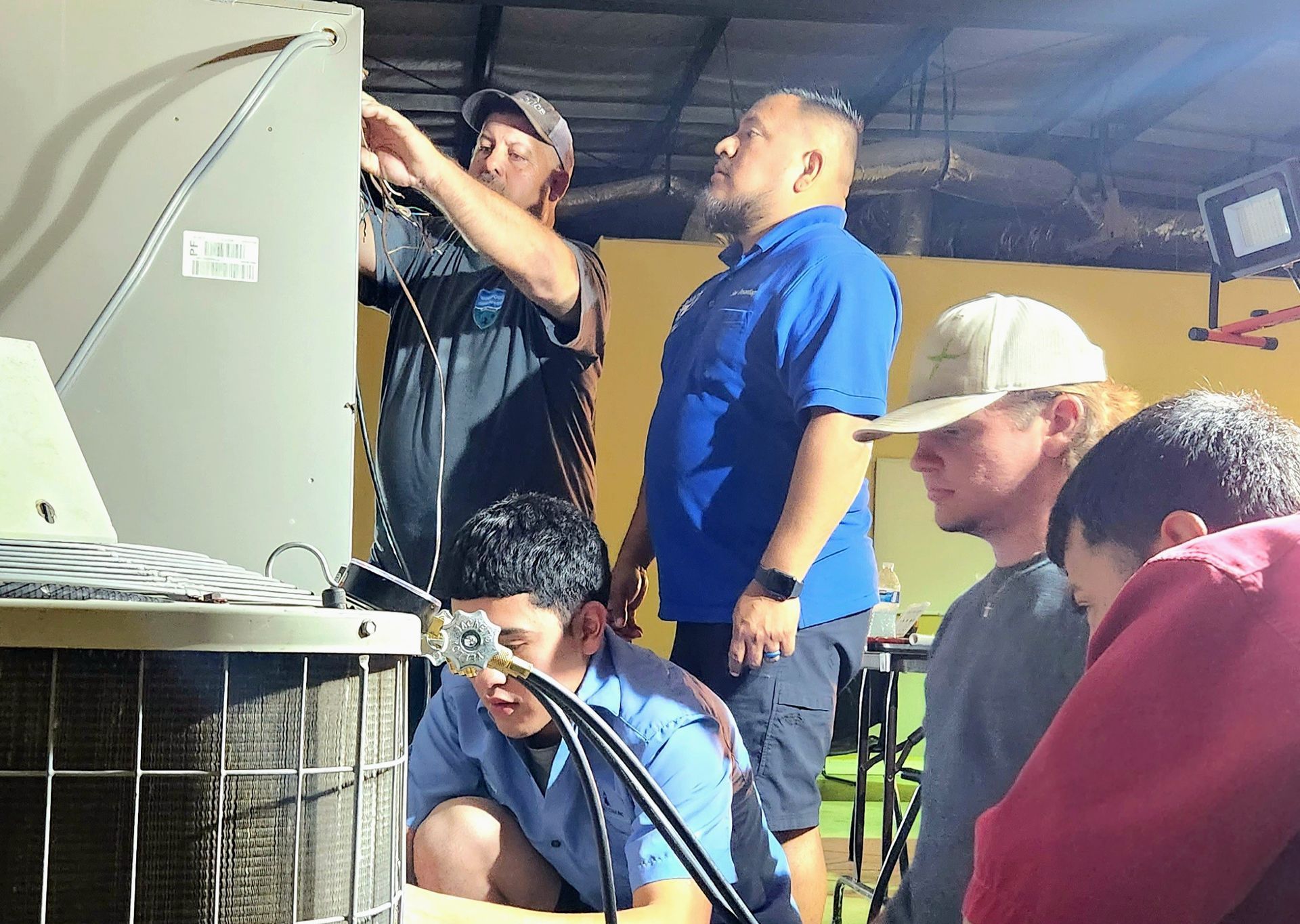 HVAC Students work on residential unit