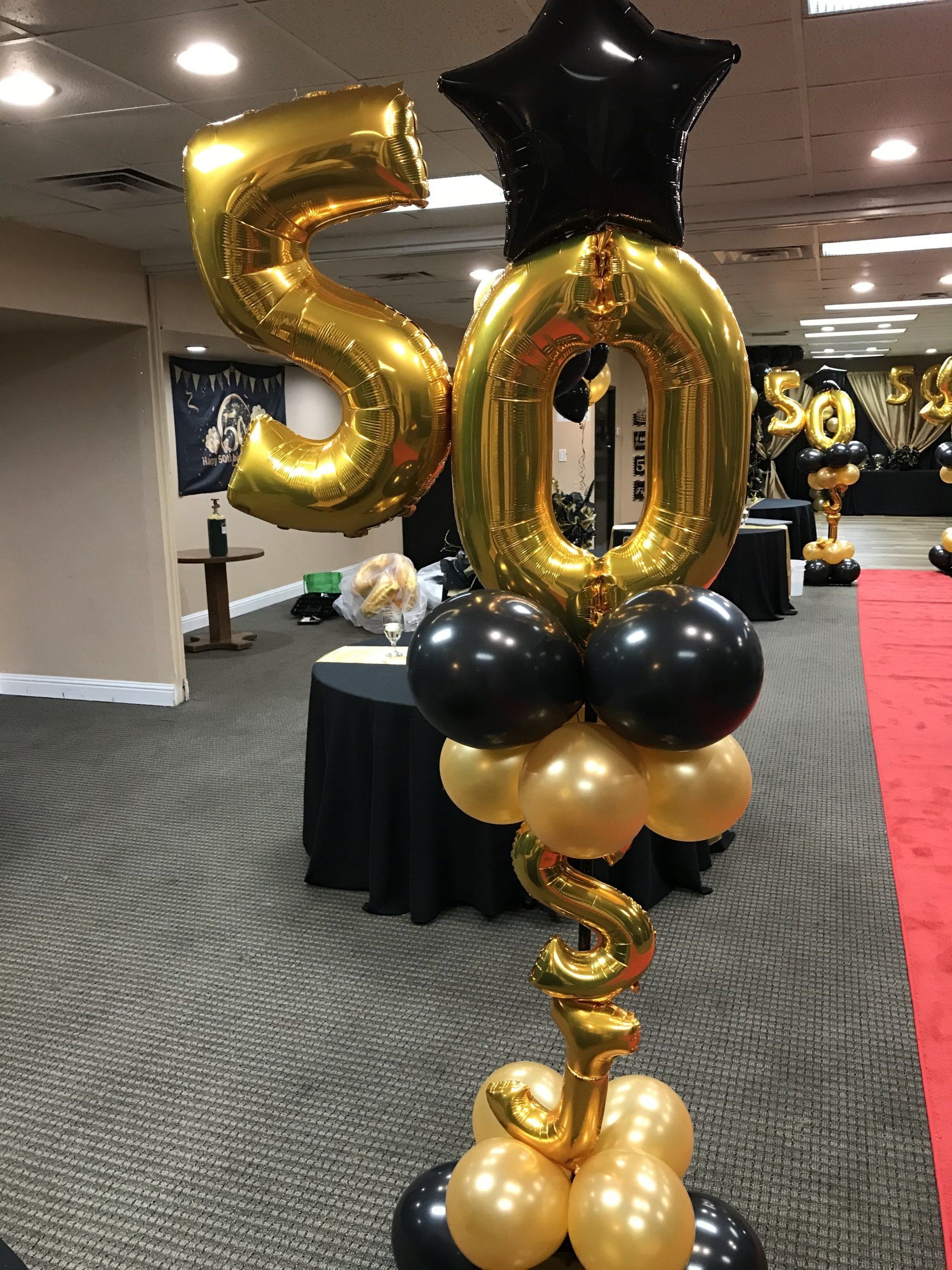 Custom number 50 gold and black foil balloons