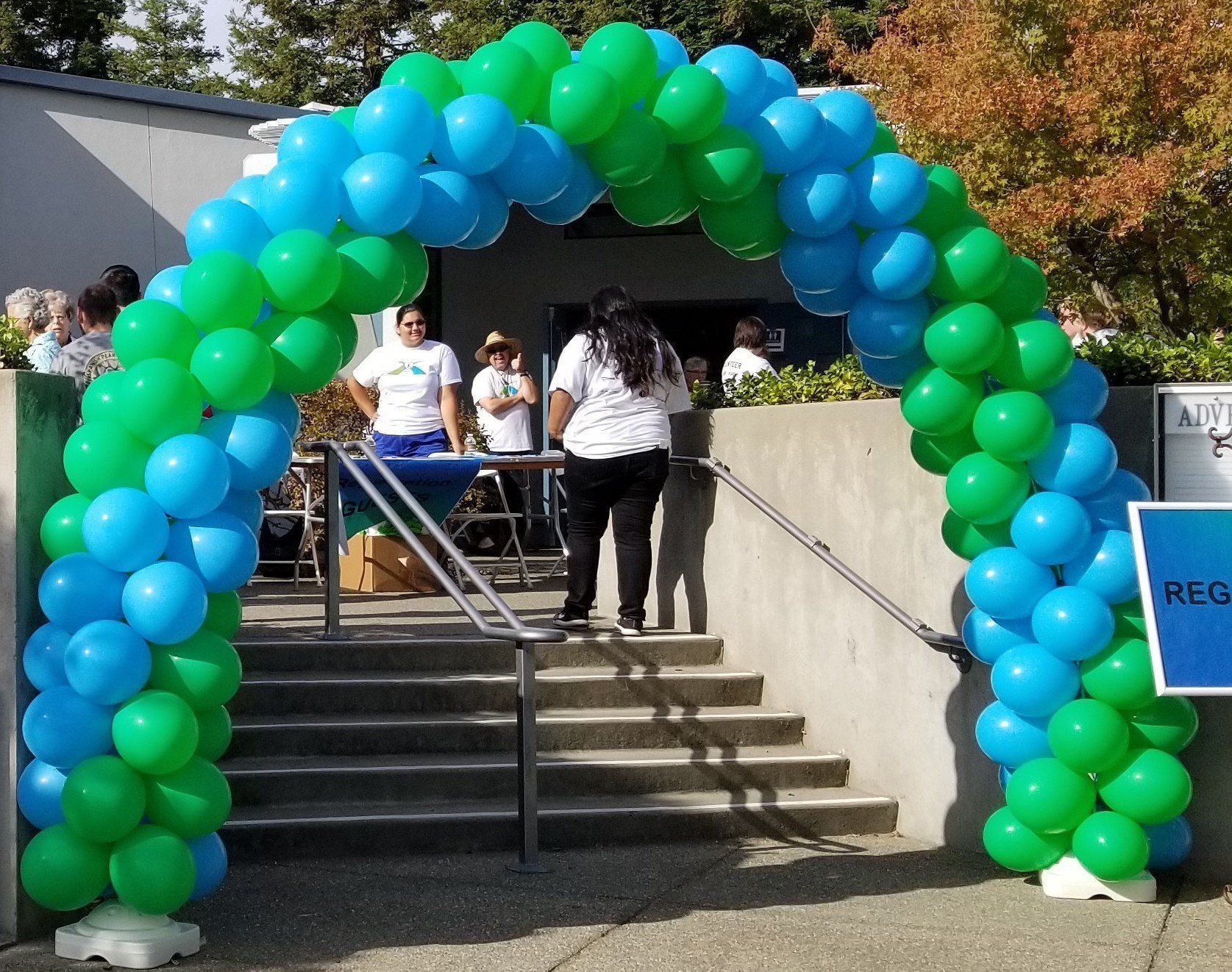 Blue and green spiral arches in an event entrance