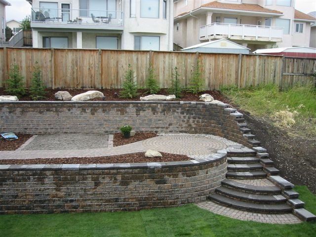 terraced retaining walls on sloping back yard