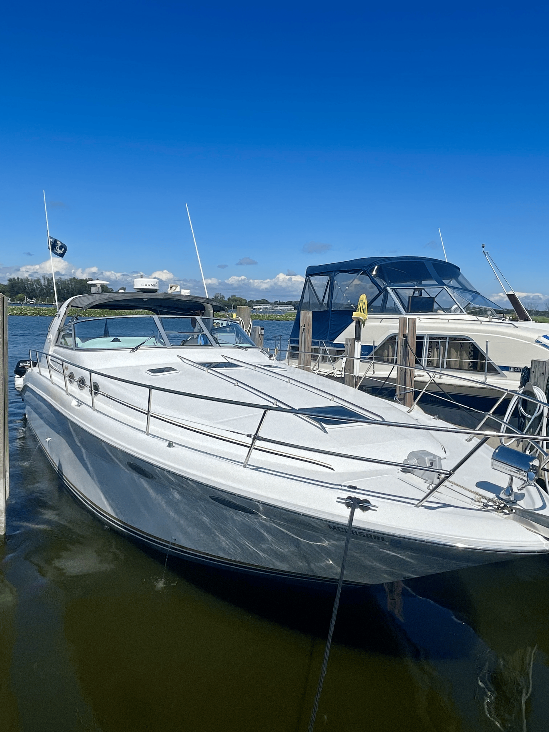 A group of sailboats are floating on a body of water