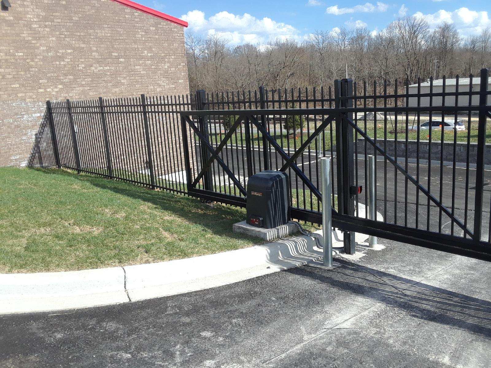Black metal fence and gate operator installed by Best Fence & Gate in Louisville, KY