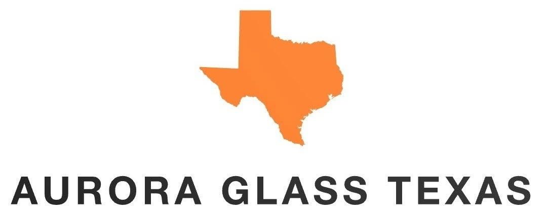 Man in cap installing a framed mirror. Orange frame, white wall. Aurora Glass Texas logo.