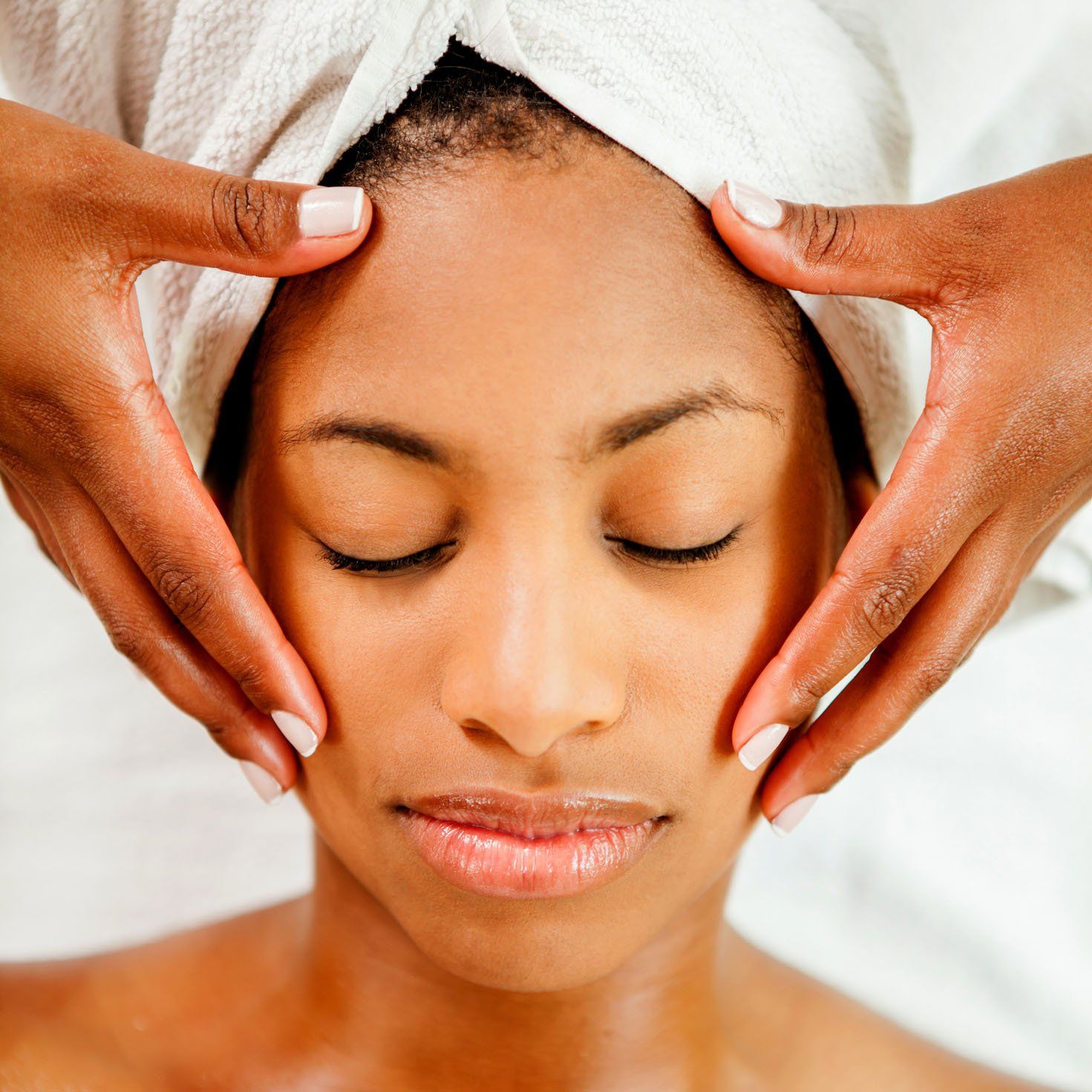 Woman getting a face massage — New Carrollton, MD — Hair Academy