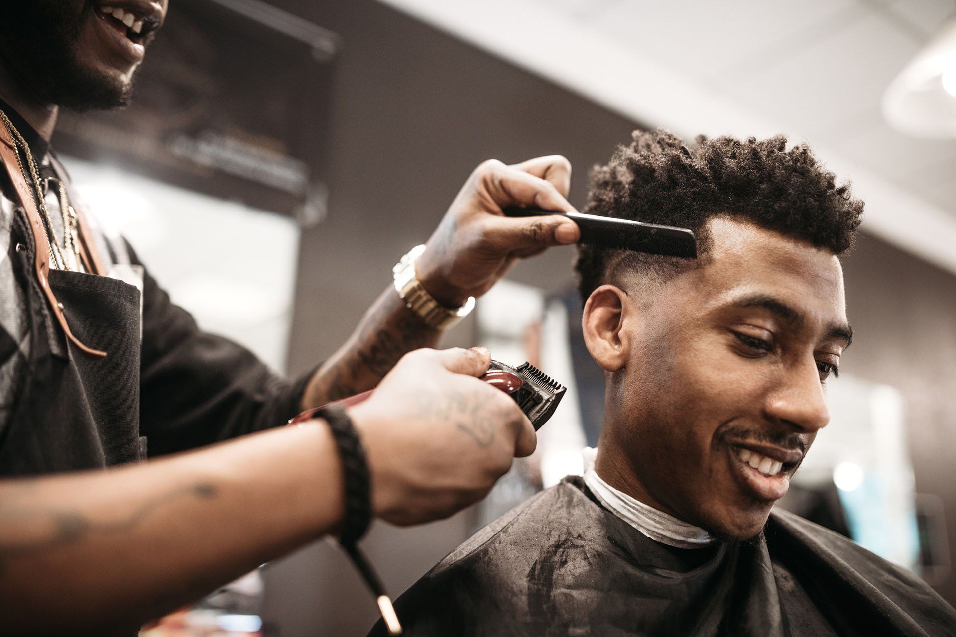 Man gets his hair cut by a stylist — New Carrollton, MD — Hair Academy