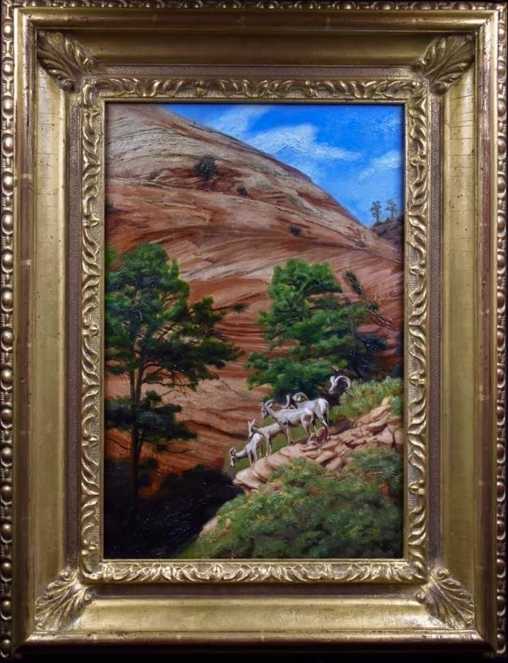 A painting of a herd of sheep in a gold frame