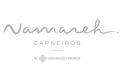 A logo for a company called namareh carneiros by gramado parks.