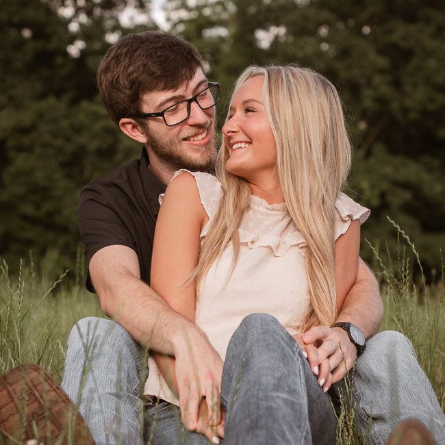 A couple posing for couple photos looking into each others' eyes.