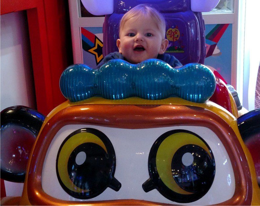 Amusement arcade at Westward Ho! Devon, UK including cars for your babies to have their first drive in