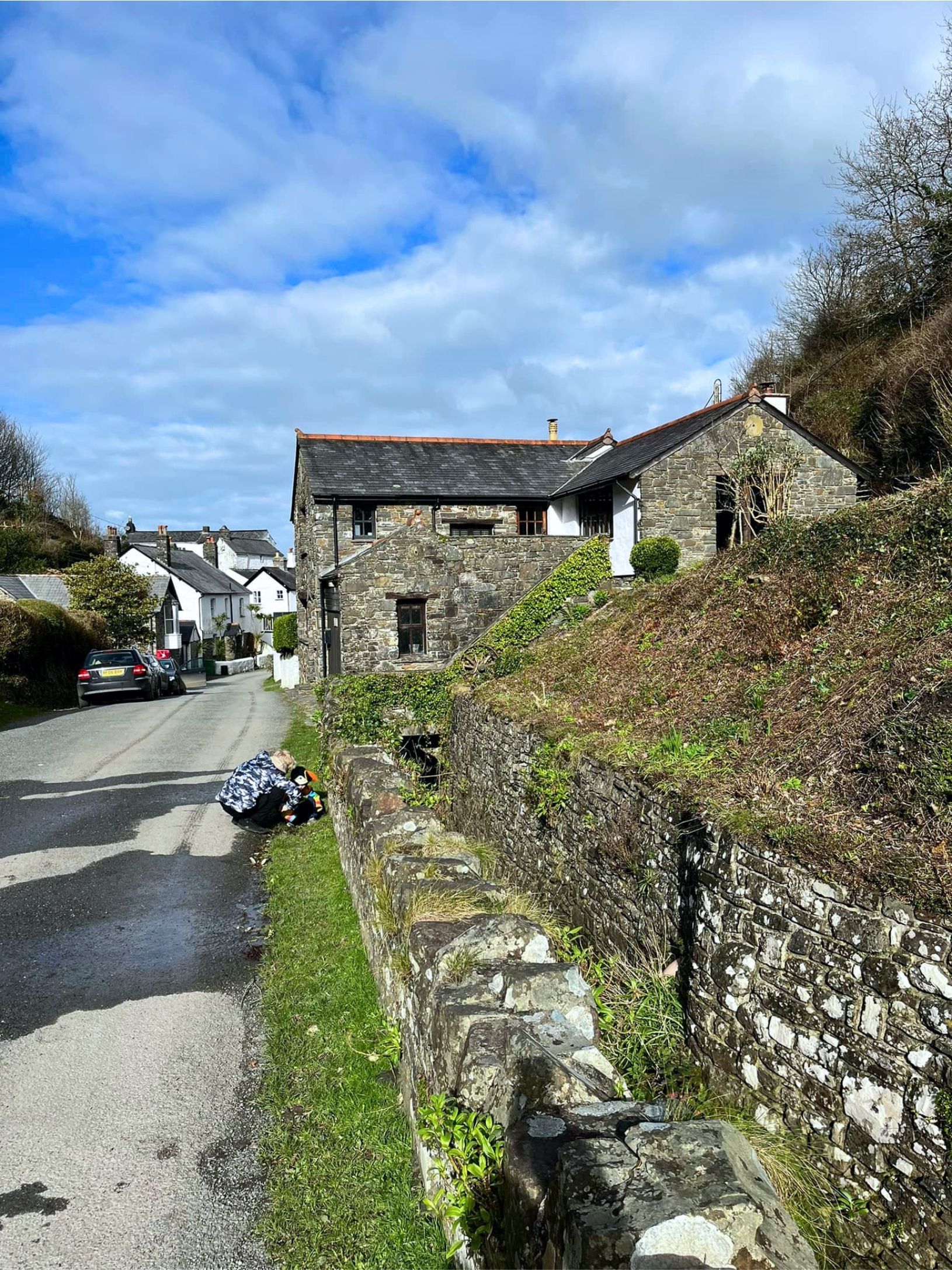 Bucks Mills is a tiny village on the North Devon coast line. Stone built houses leading down to a pebble and stone beach with a bit of sand at low water