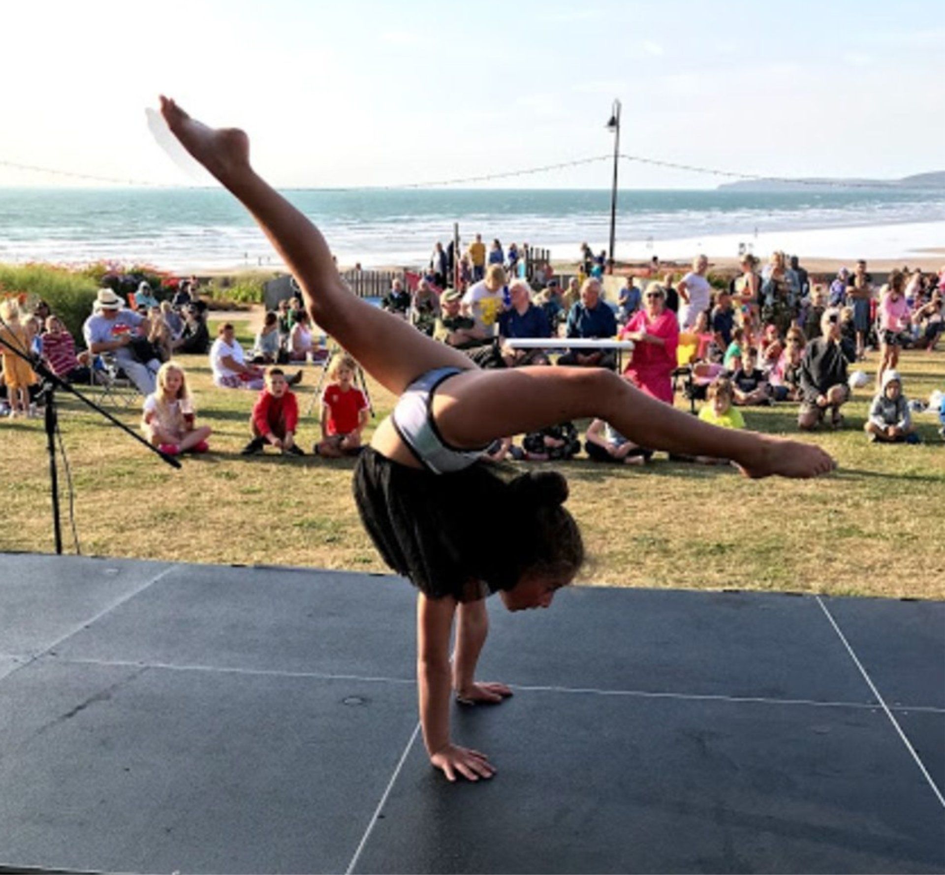 Libby Lamont performing contortion at the Sunset Festival in Westward Ho!