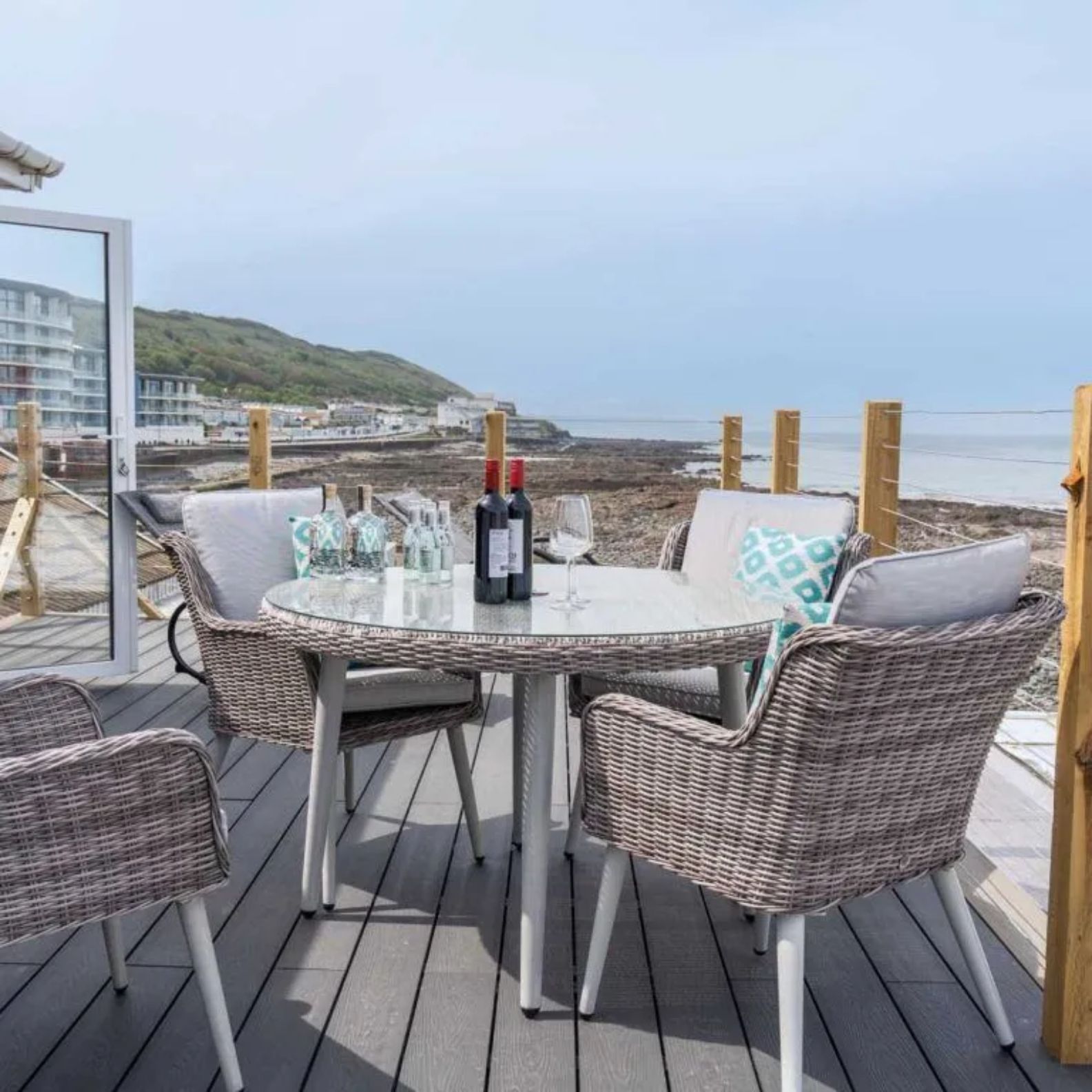 A people watching paradise on the promonade at Westward Ho! North Devon. The balcony here is elevated above the sea front, relax and watch the waves lap the seashore.