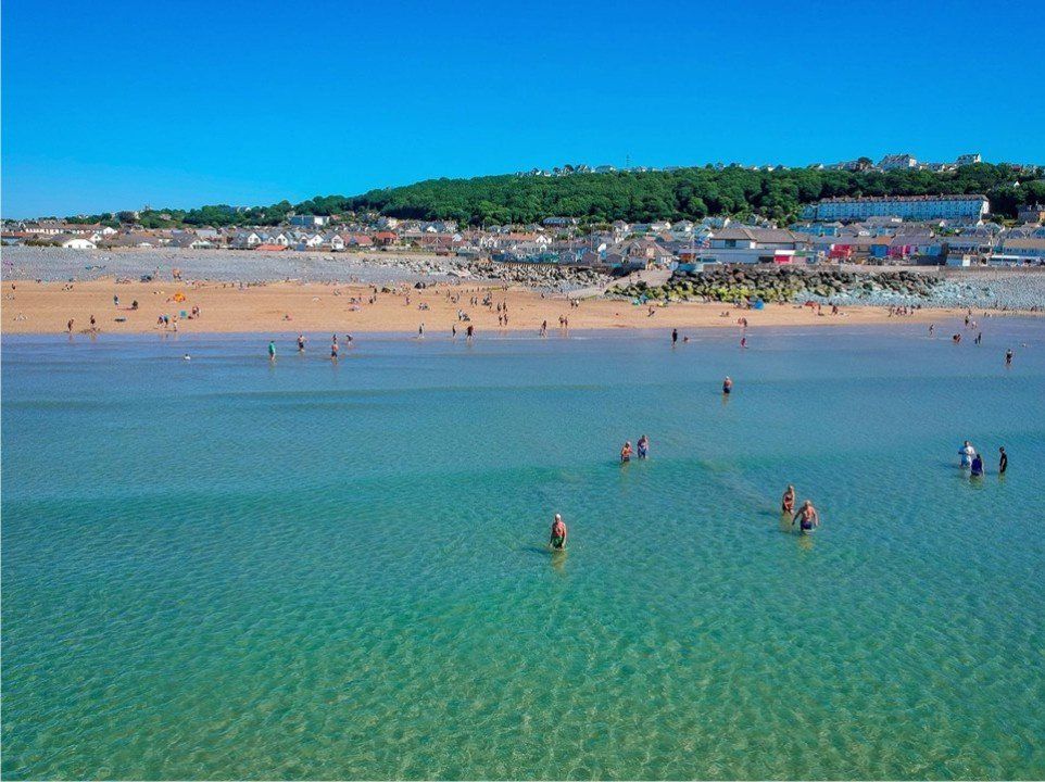 The sea can get really, really clear in the Summer season, Westward Ho! in this photo looks beautiful and still