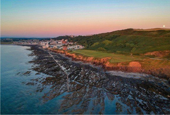 Westward Ho! drone shot looking down the South West coast path back into the village