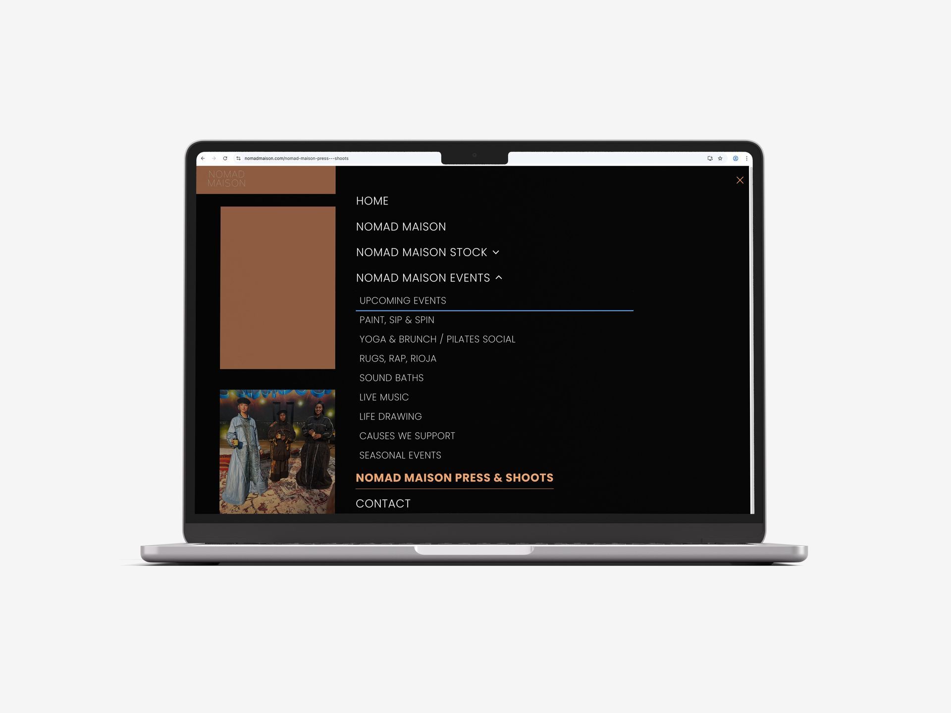 Laptop displaying a website with a dark background and a list of menu options, including a photo.