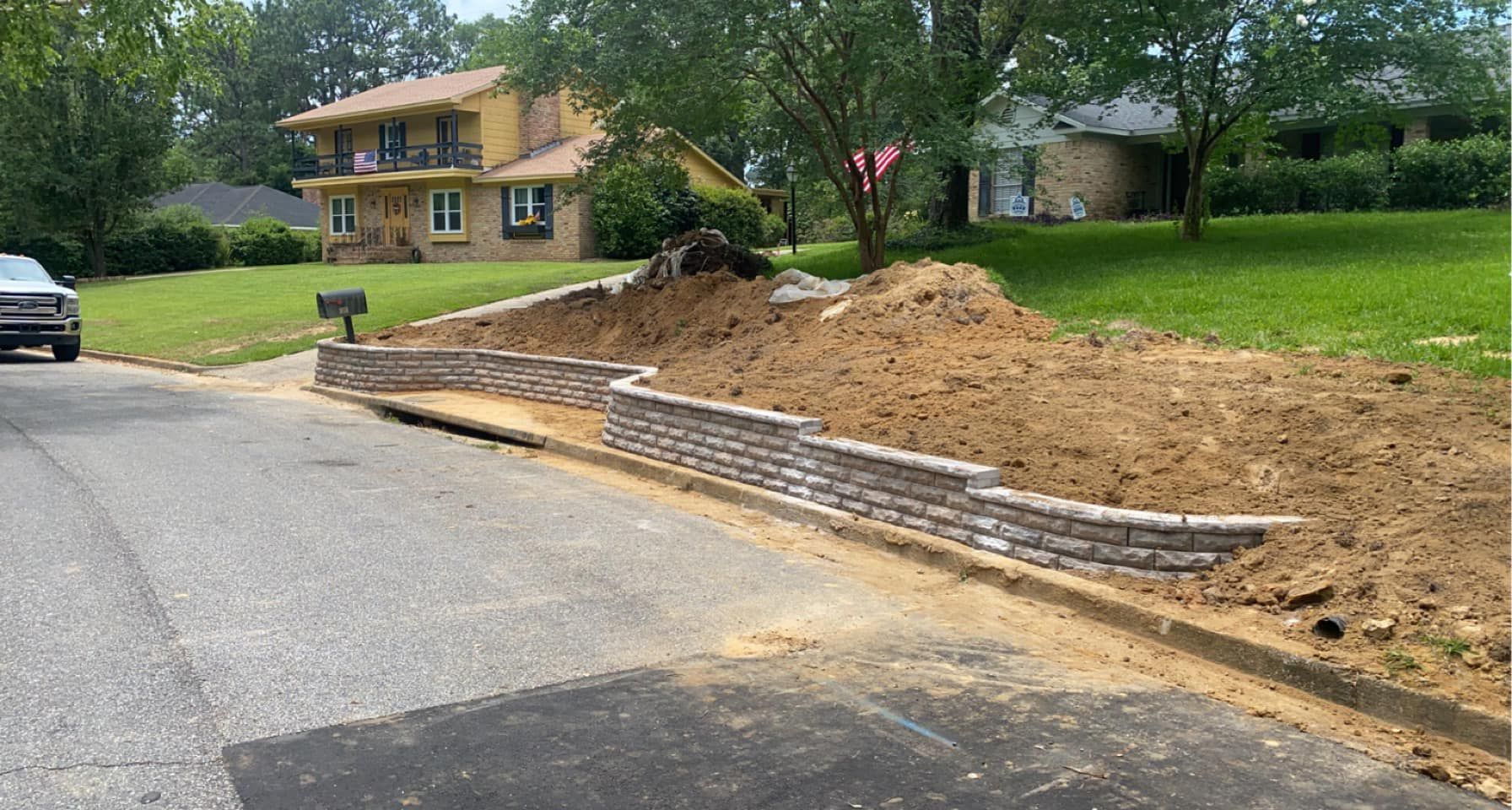 A car is parked on the side of the road in front of a house.