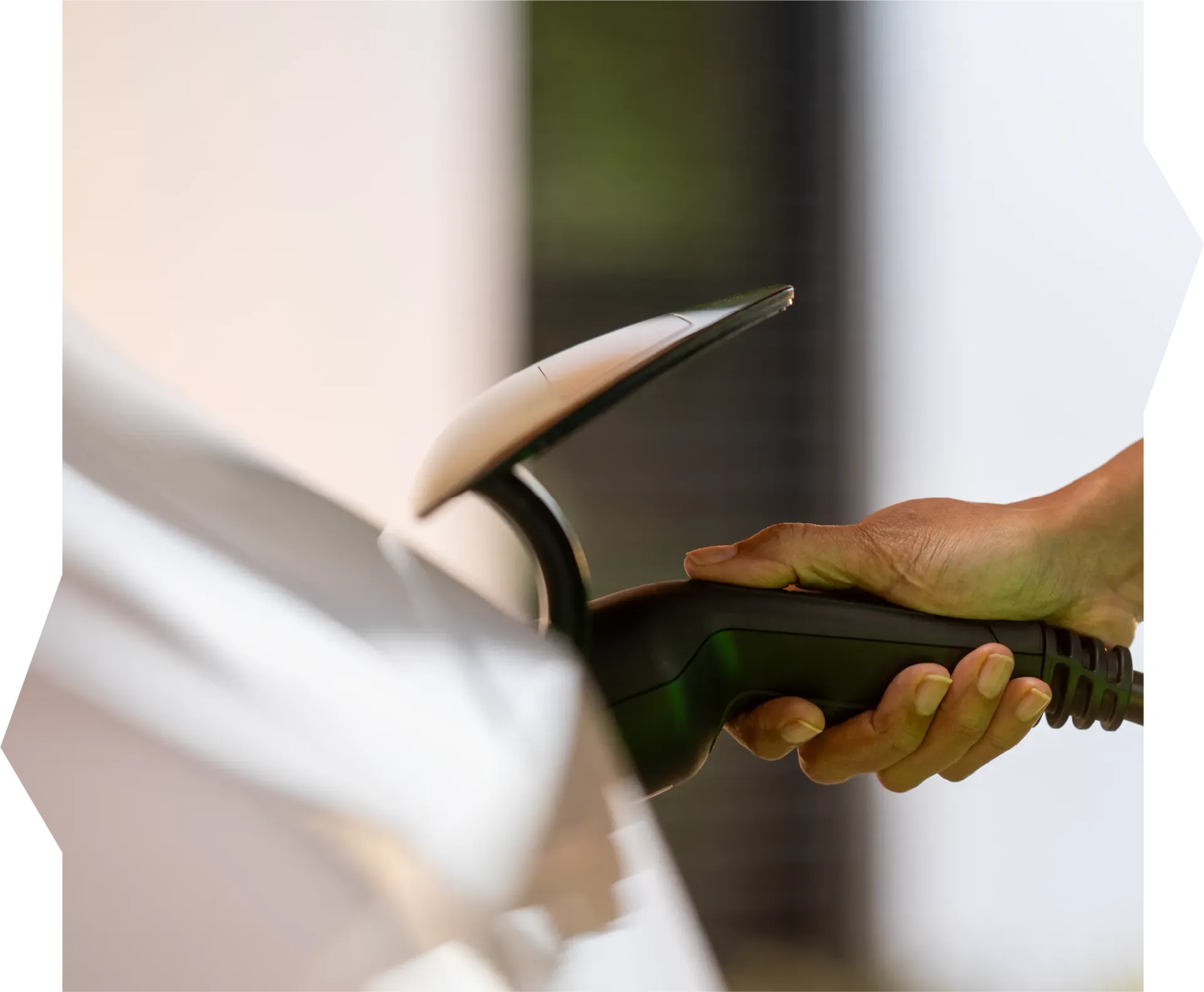 A person is opening a car door with a key.