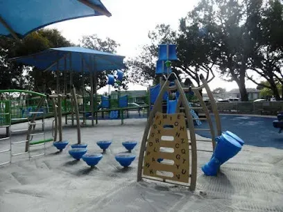 Tree Services West Covina Two cactus wrens on a spiky cactus; one has wings spread, displaying plumage. The setting is a sunny desert, conveying a sense of natural beauty.