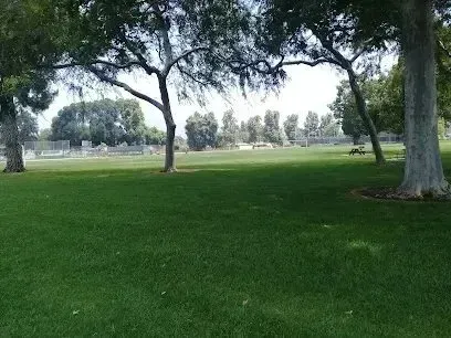 Tree Services West Covina – Las Flores Park showcases a beautifully maintained landscape with lush green grass and well-spaced trees providing ample shade.