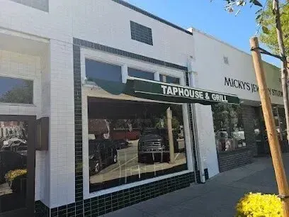 Tree Services West Covina – The charming exterior of Lordsburg Taphouse & Grill in West Covina is complemented by well-maintained trees lining the sidewalk.