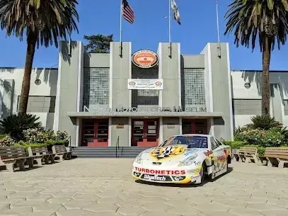 Tree Removal Service West Covina -Racing car parked in front of the Henry Mateo Museum.