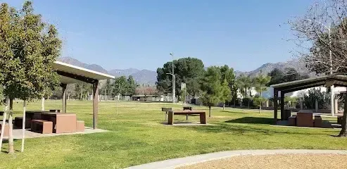 Tree Removal Service West Covina -Park picnic areas with covered tables and distant mountains under a clear blue sky.