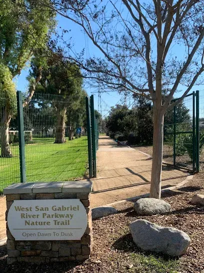 Tree Services West Covina Entrance to West San Gabriel River Parkway Nature Trail with a sign reading