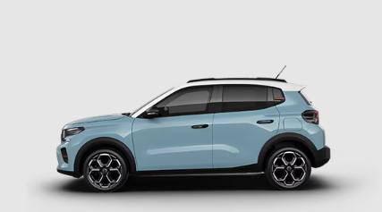 Un SUV bleu et blanc est assis sur une surface blanche.