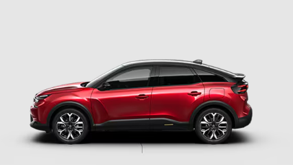 Une voiture rouge est assise sur une surface blanche.