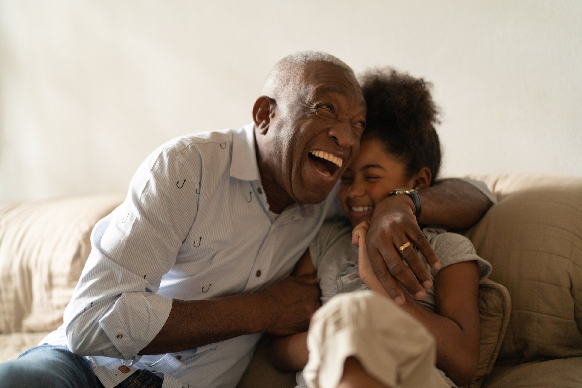 grandpa and granddaughter laughing