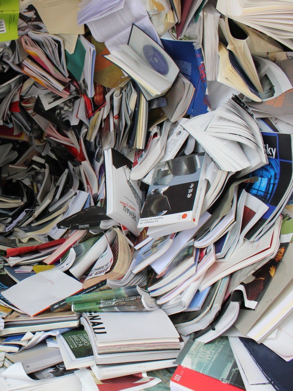 A pile of books with one that says mail on it