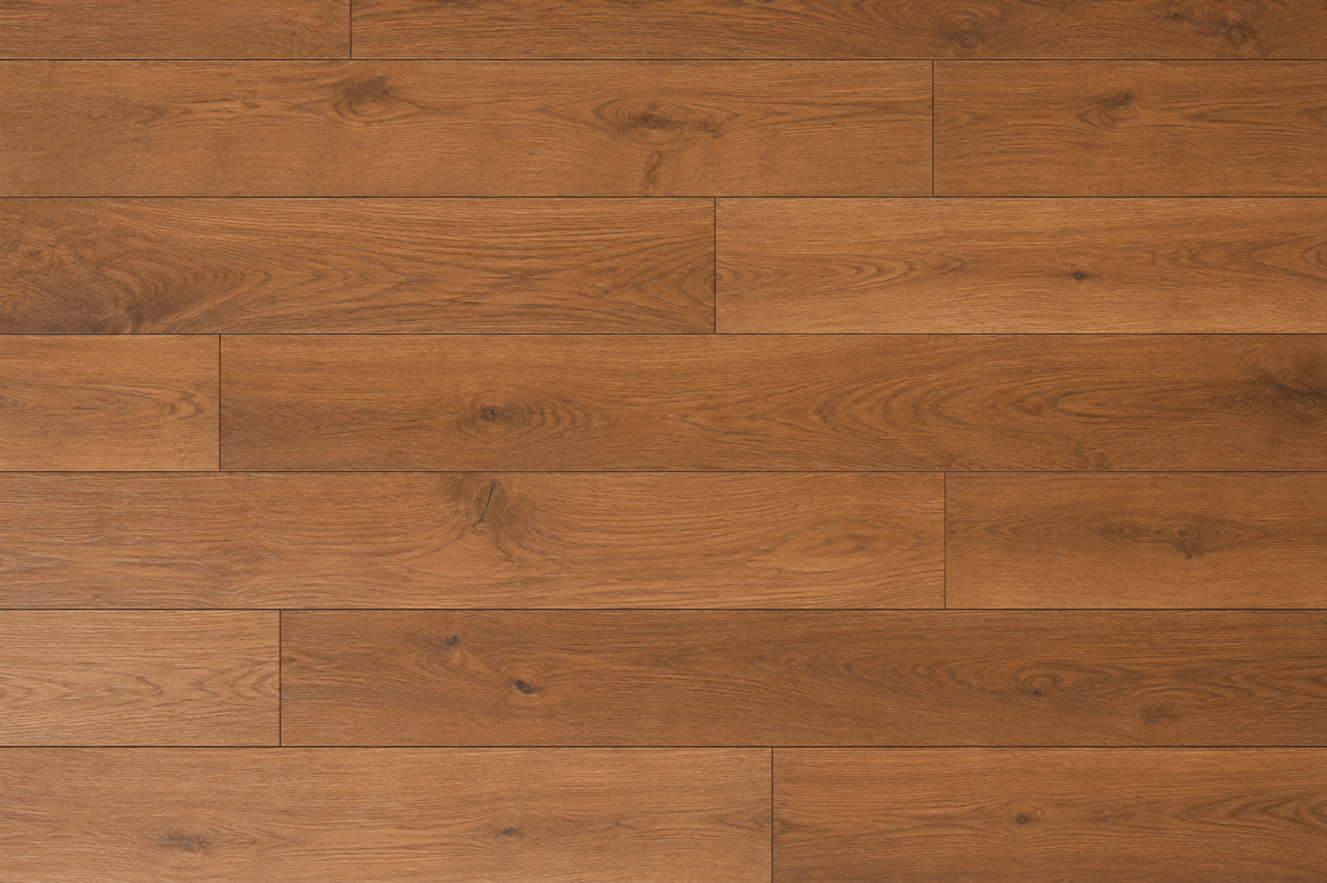 Close-up of warm brown wooden floorboards with visible grain and seams.