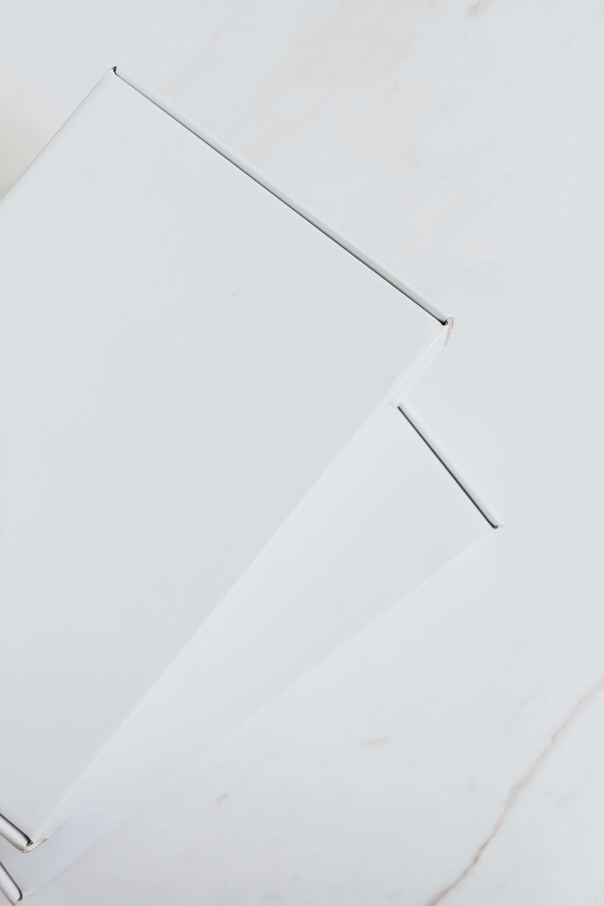 A close up of a piece of white fabric on a white background.