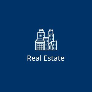 A line drawing of a city with the words `` real estate '' below it.