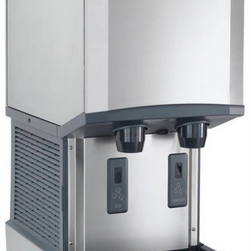 A stainless steel water dispenser with two cups on it