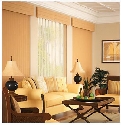 Love is Blinds St. Louis: A living room with a yellow couch, a coffee table, and vertical blinds on a glass door. 