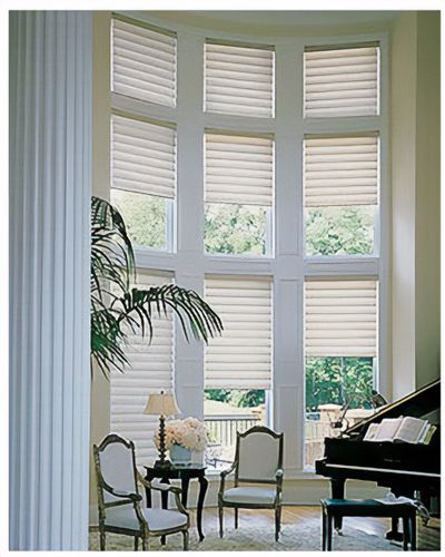 Love is Blinds St. Louis: A living room with a piano and lots of windows with dual shades. 