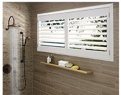 Love is Blinds MO: A bathroom with a shower and a window with shutters.