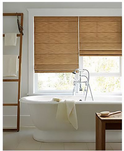 Love is Blinds MO: A bathroom with a bathtub and a window with roman shades.